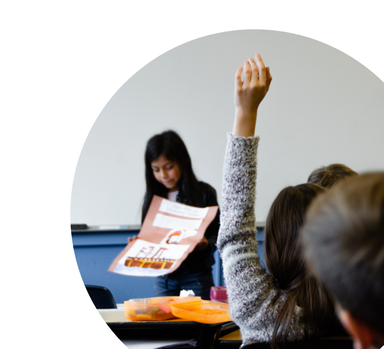 student with raised hand