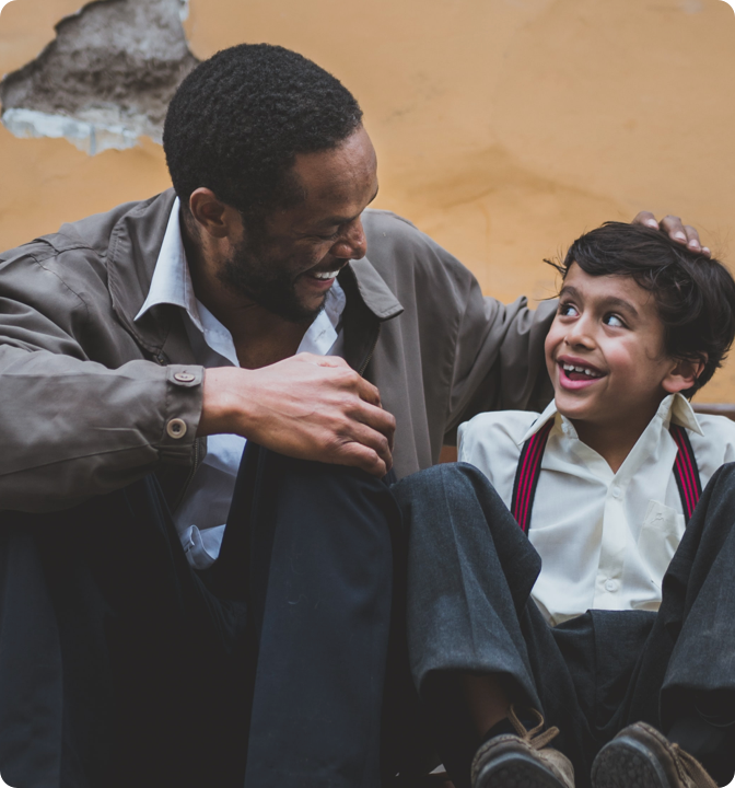 Father and son smiling