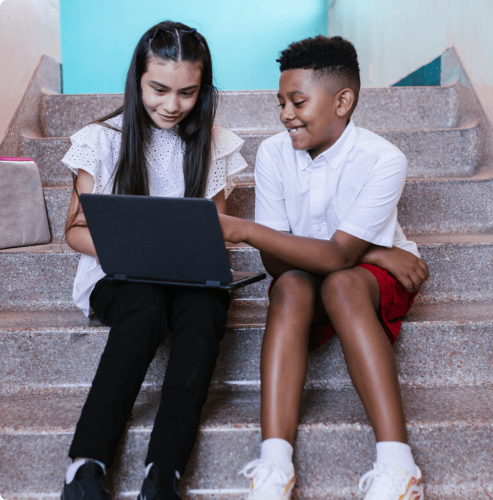 Two students sitting on stairs together